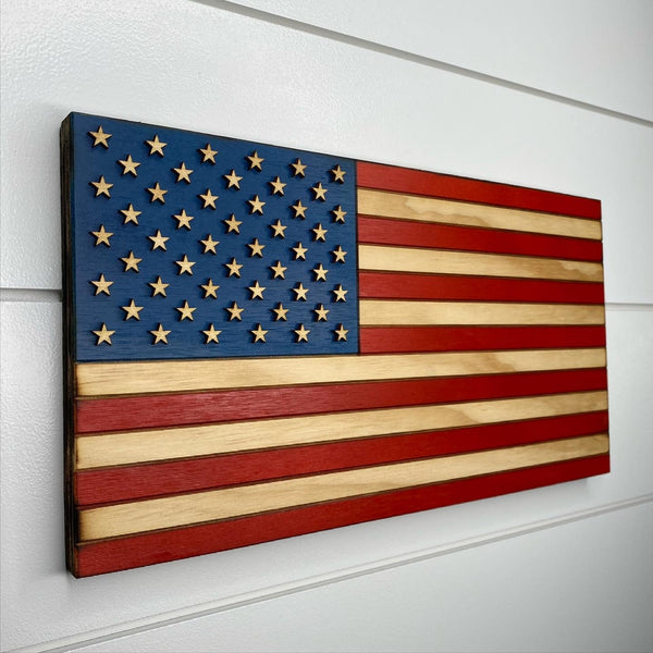 twenty four inch red white and blue american flag with laser engraving and laser cut stars left angle view